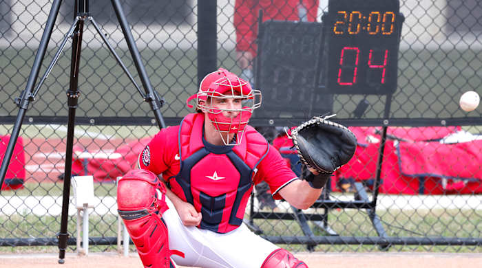 A new pitch clock counts down as Washington Nationals catcher Riley Adams catches a pitch during spring training workouts at the Ballpark of the Palm Beaches.